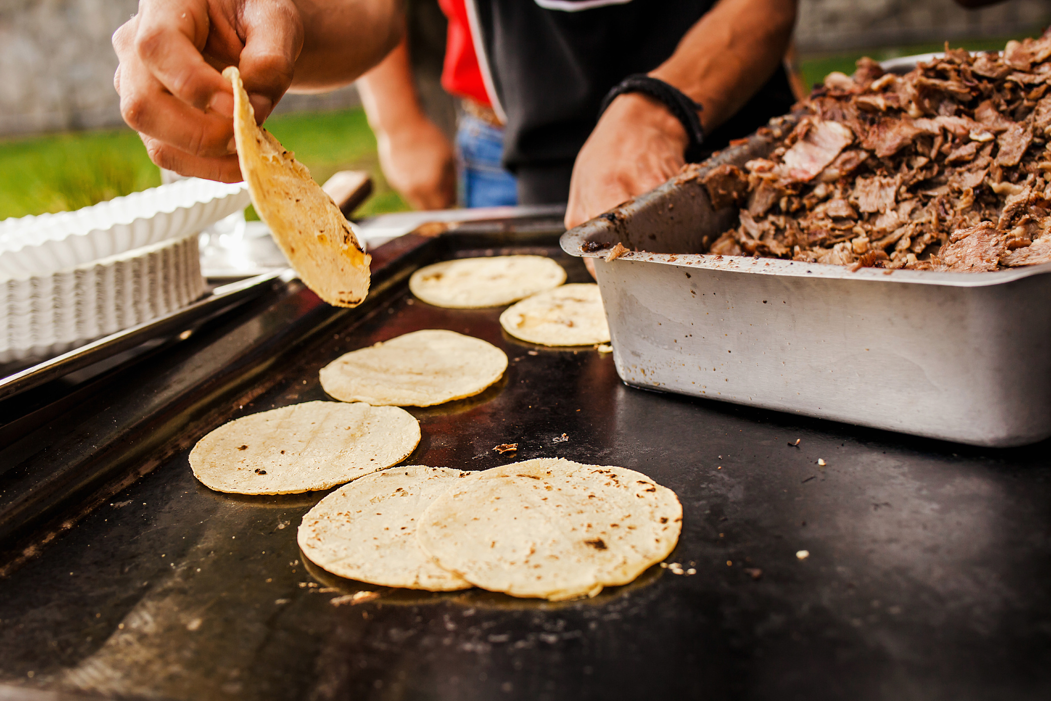 Mexican taquero making Tacos al Pastor in Mexico city